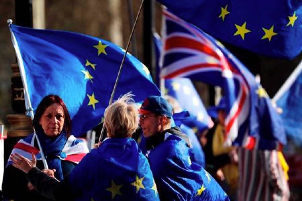 Brexit protesters demonstrate near the House of Parliament in London, Tuesday, March 26, 2019. British Prime Minister Theresa May’s government says Parliament’s decision to take control of the stalled process of leaving the European Union underscores the need for lawmakers to approve her twice-defeated deal. (AP Photo/Frank Augstein)