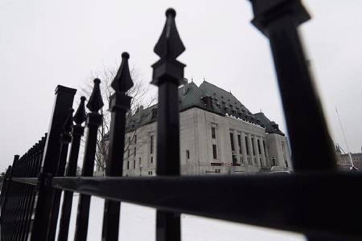 The Supreme Court of Canada is shown in Ottawa on January 19, 2018. The Supreme Court of Canada says making an accused person wait in jail before trial should be the exception, not the rule, in a decision that affirms a key legal safeguard intended to ensure speedy justice. In a 9-0 ruling today, the high court says people accused of crimes are automatically entitled to periodic reviews of their detention under provisions set out in the Criminal Code. In clarifying how the provisions should work, the court says Parliament intended to ensure people awaiting trial have their cases reviewed by a judge at set points in time to consider whether keeping them in jail is justified. THE CANADIAN PRESS/Sean Kilpatrick