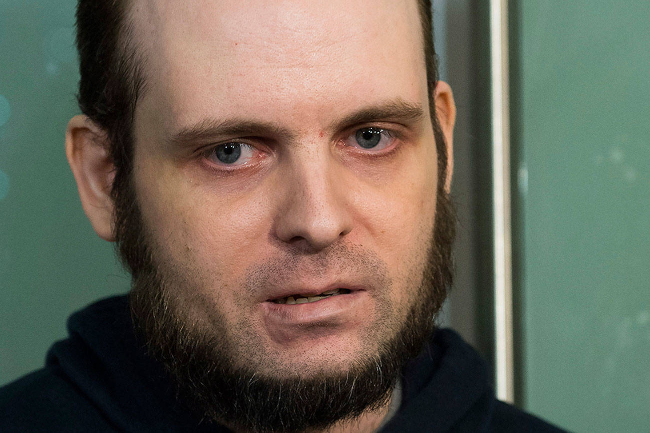 Joshua Boyle speaks to the media after arriving at the Pearson International Airport in Toronto on Friday, Oct. 13, 2017. Boyle, his wife Caitlin Coleman, and their three children landed in Canada after they were kidnapped in Afghanistan while on a backpacking trip and held hostage for five years by the Taliban-linked Haqqani network. (Nathan Denette/The Canadian Press via AP)