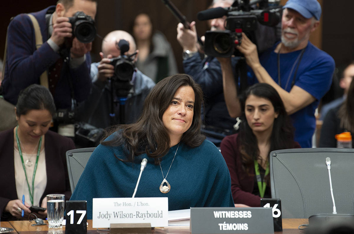 Cameras follow Jody Wilson Raybould as she waits to appear in front of the Justice committee in Ottawa, Wednesday February 27, 2019. (Adrian Wyld/The Canadian Press)