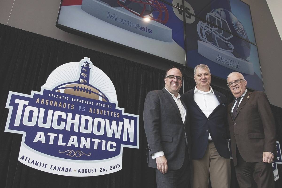 Anthony LeBlanc, Founding Partner, Schooners Sports and Entertainment, Randy Ambrosie, Commissioner, Canadian football League, and Greg Turner, Councillor-at-Large and Deputy Mayor, City of Moncton pose for a photo at a press conference in Moncton, N.B., on Friday, March 29, 2019. (Ron Ward/The Canadian Press)